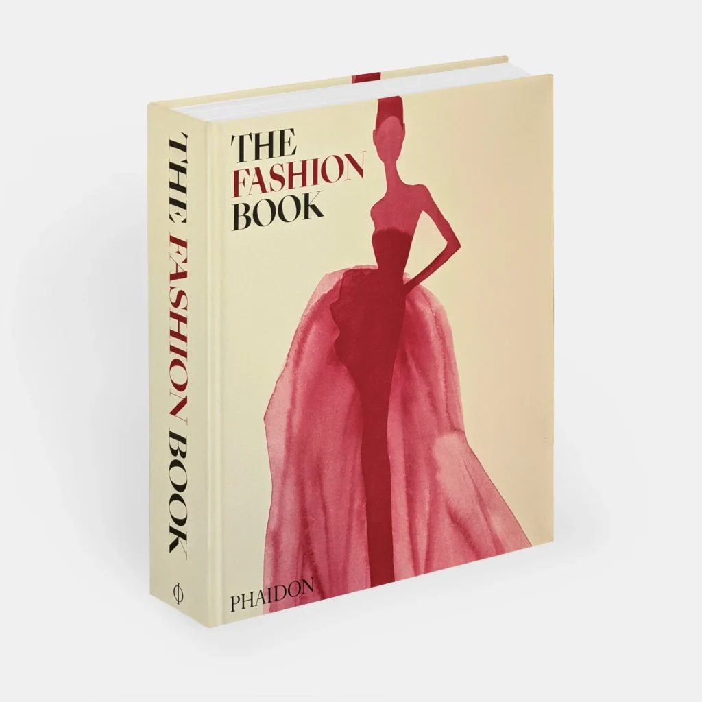 A fashion book with a stylized illustration of a model in a red gown on the cover.