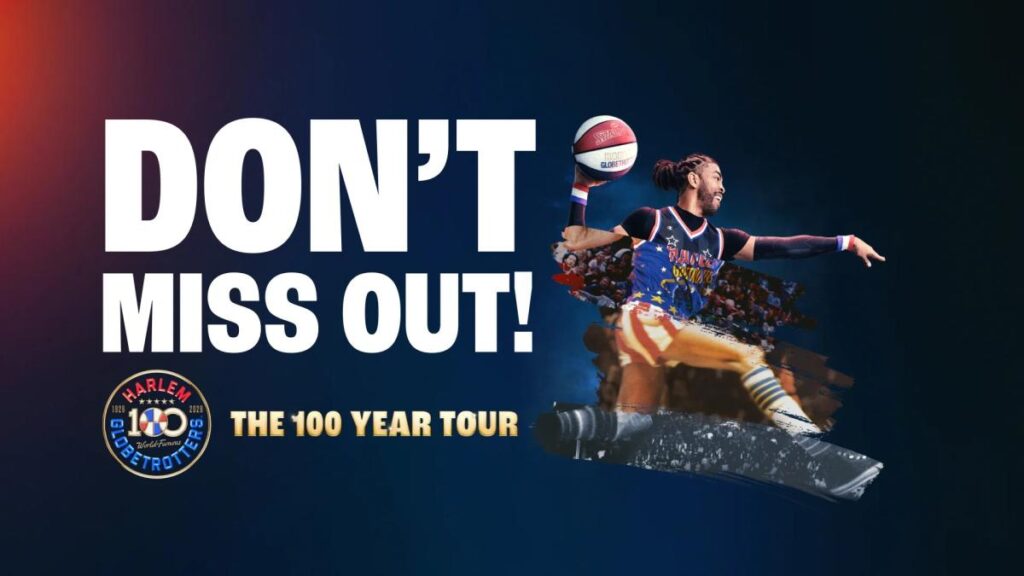 A Harlem Globetrotters player performs a basketball trick, promoting the 100-year tour.