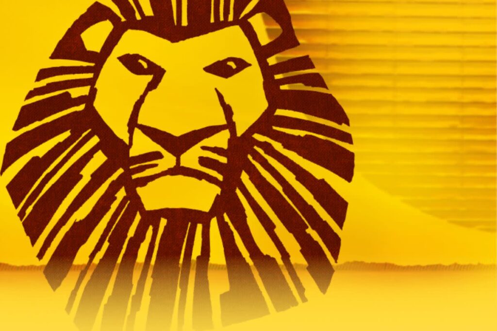 Lion graphic in warm yellow tones, featuring bold lines and stylized mane.