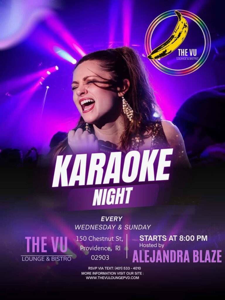 A woman sings passionately on stage during karaoke night at The Vu Lounge, with colorful lights in the background.
