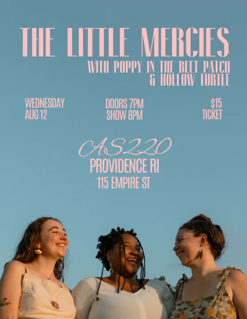Three women smile together outdoors, promoting a music event at AS220 in Providence, RI.
