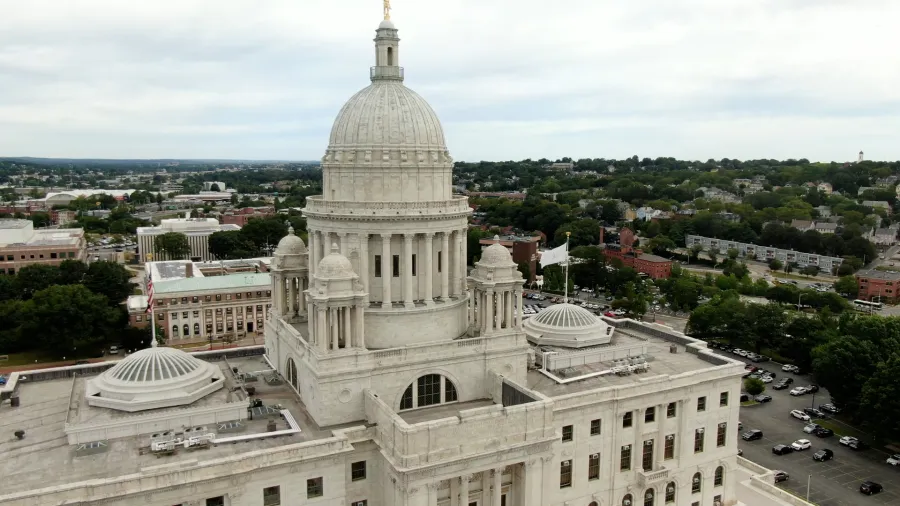Aerial view of the Rhode Island State House, showcasing its dome and surrounding cityscape.