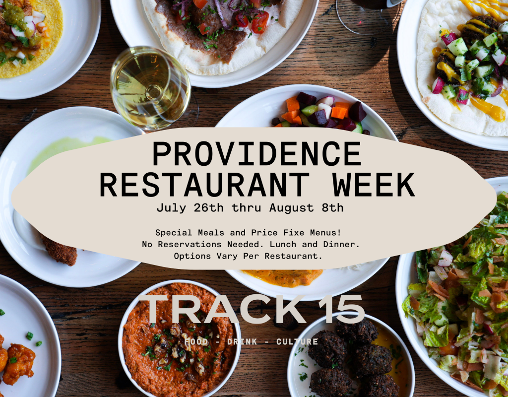 Various dishes and drinks arranged on a wooden table, promoting Providence Restaurant Week.