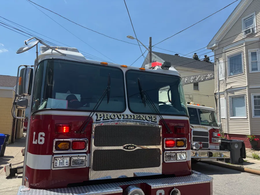 Fire trucks parked on a street, with one truck labeled "PROVIDENCE" in clear view.