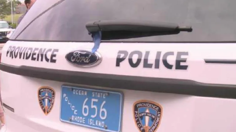 Providence police vehicle displaying badge and license plate number 656.