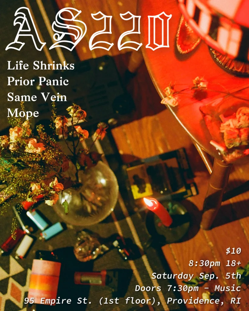 Event flyer for AS220 featuring band names, date, time, and location details. Candles and decorative items are visible.