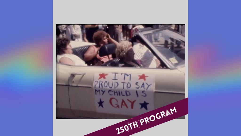 People sit in a convertible car displaying a sign that reads, "I'M PROUD TO SAY MY CHILD IS GAY.