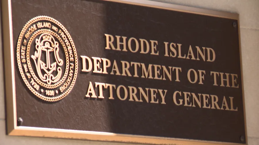 Bronze plaque displaying "Rhode Island Department of the Attorney General" with state seal.