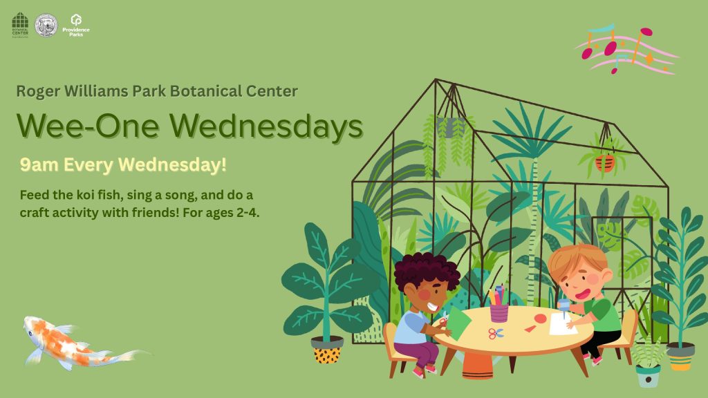Two children engage in craft activities at a table surrounded by plants in a greenhouse.
