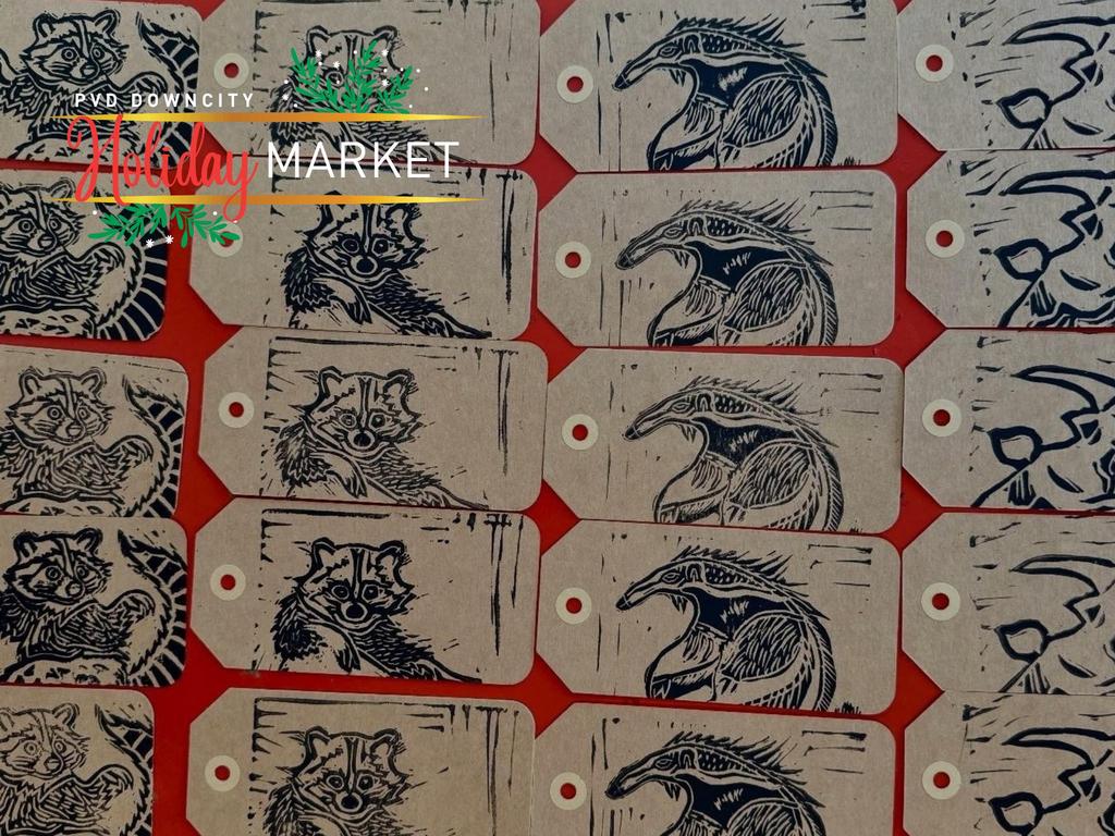 Multiple illustrated tags featuring raccoons and other animals on a red background.